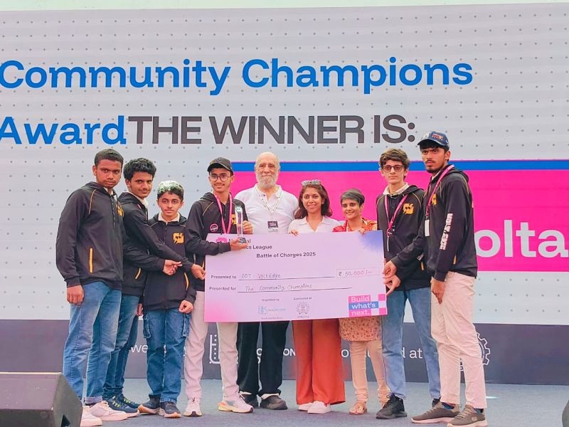 Team VoltEdge receiving the Community Champions Award on stage at IIT Bombay