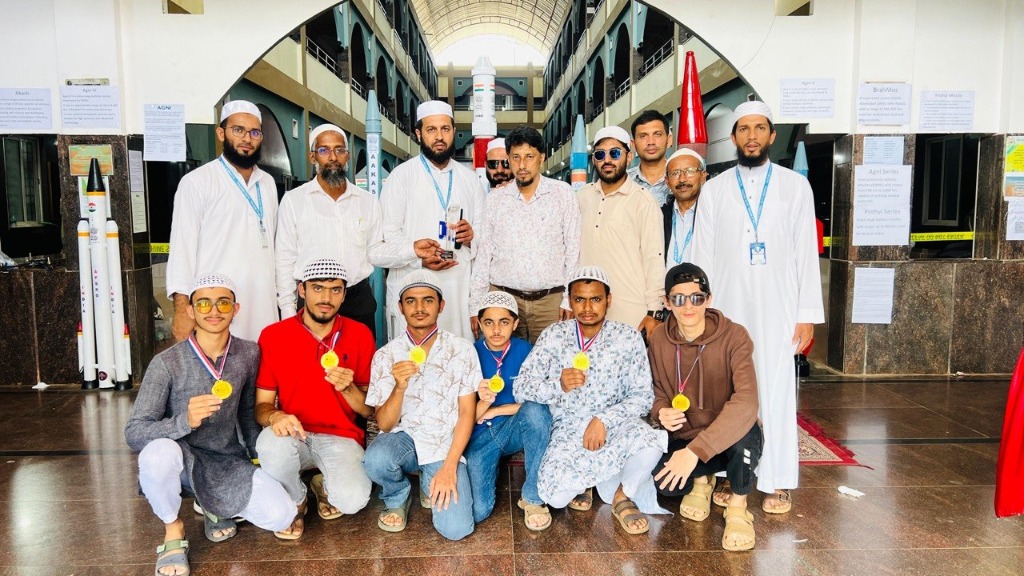 Photo with college faculty members during visit